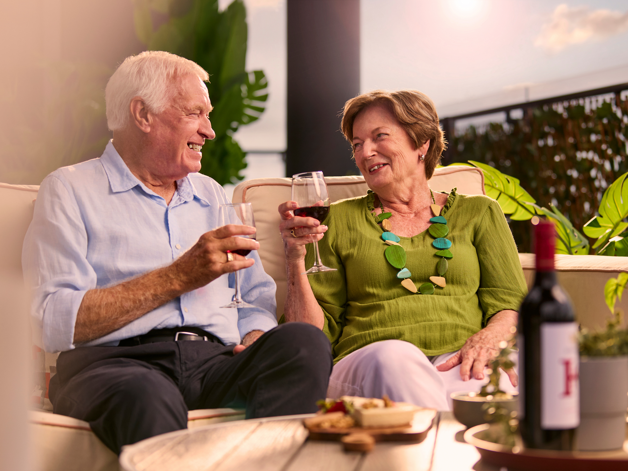 Residents having drinks on their apartment balcony