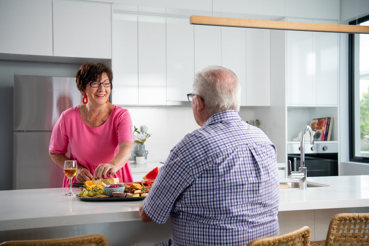 Residents happily in their villa kitchen